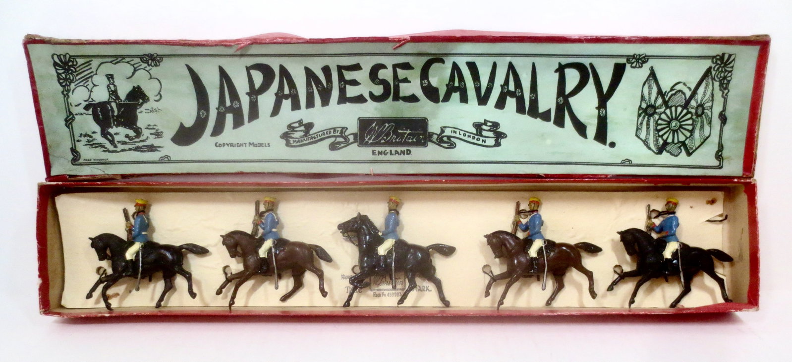 Britains #135 Japanese Cavalry: Circa 1904 -1924. 5 pieces. Pristine condition, retied to card in box. Whisstock label box in fair condition (water damaged tie card, top corner tears and repairs).