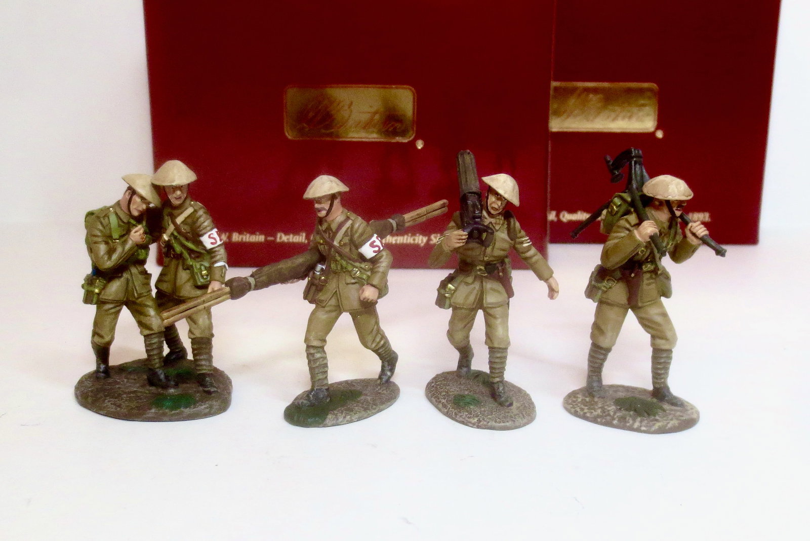 Britains World War I Sets: British Vickers Gun on The Move #23022, and Stretcher Bearer Set #23023. 5 pieces. Mint condition. Boxes excellent.