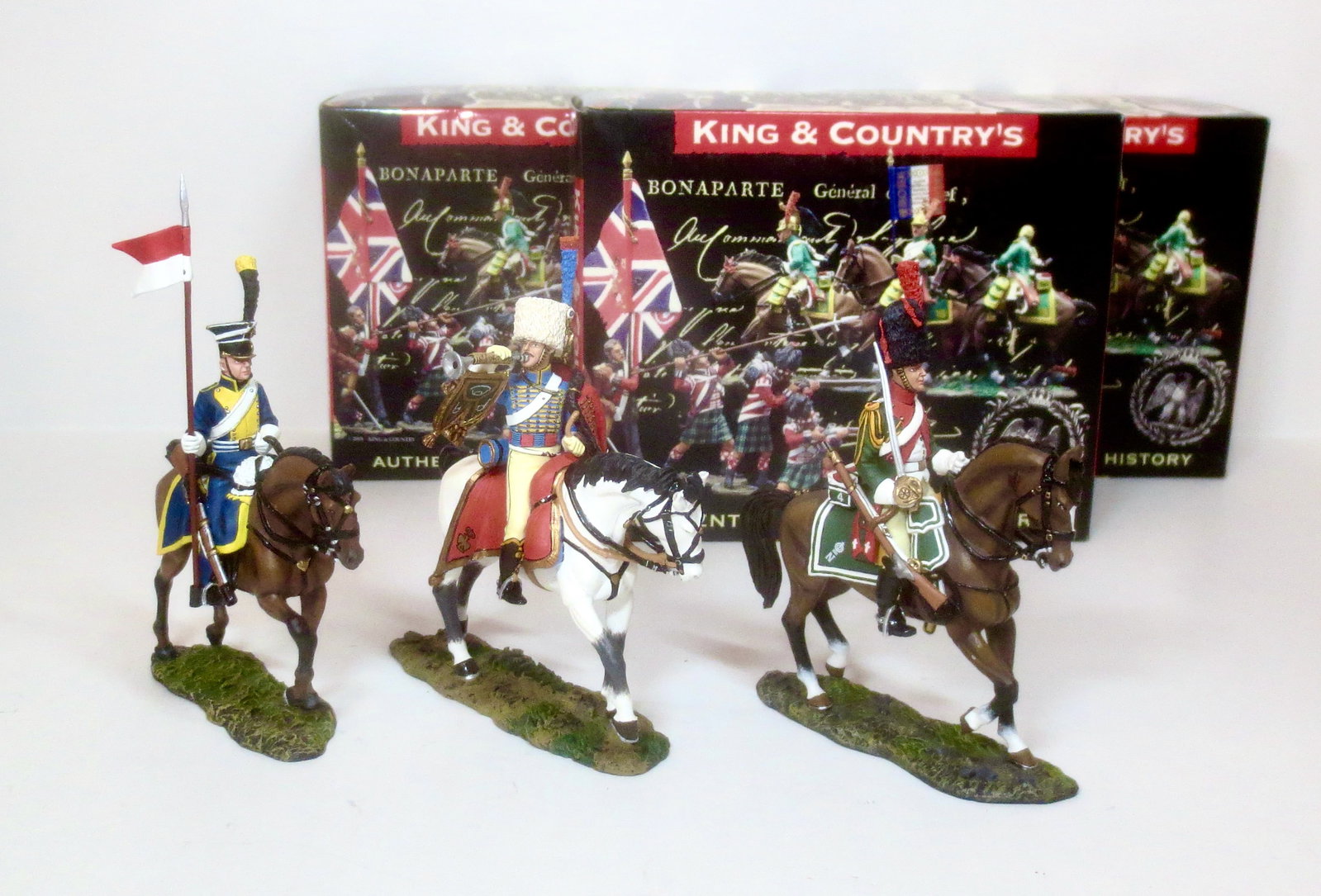 King & Country Napoleonics: Chasseur Trumpeter #NA094, Dragoon Elite Company #KCS073 and Vistula Lancer #KCS074. 3 pieces. Mint condition. Boxes excellent.