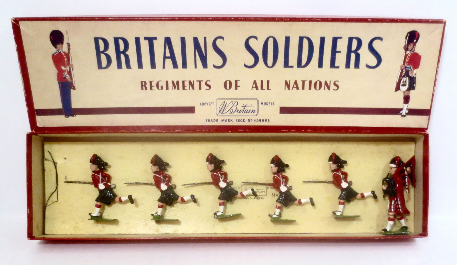 Britains #11 The Black Watch Charging: Post war. 6 pieces. Mint to near mint condition, retied to card in box. Box excellent.