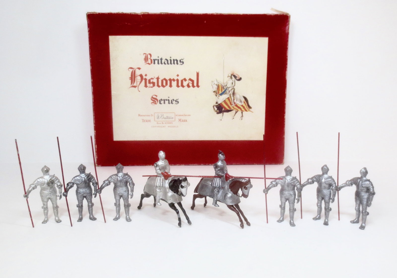 Britains #1307 16th Century Knights: Circa 1933-1941. 8 pieces (missing one mounted figure). Excellent to very good condition. With Britains Historical Series labeled box in fair condition (splits and taped repairs).