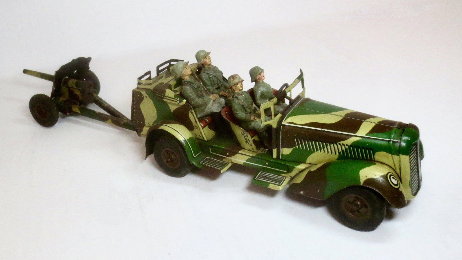 Hausser Tinplate Field Car & Gun: With driver and crew. 5 pieces. Car is 8" long, Gun is 6.5" long. Excellent condition (one loose wheel). No key, untested.