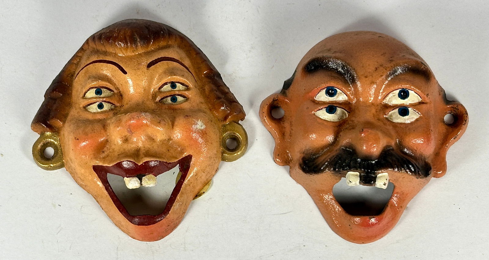 Four Eyed Lady & Man Cast Iron Bottle Opener: John Wright Co., PA. 2 pieces. 3-1/2 & 4-1/4"T. c. 960. Catalog No. F11&F1