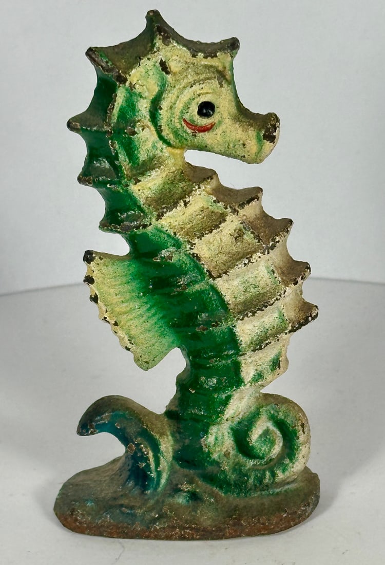 Seahorse Cast Iron Bottle Opener: John Wright Co., PA. 4-1/4"T. c.1950. Catalog No. F140