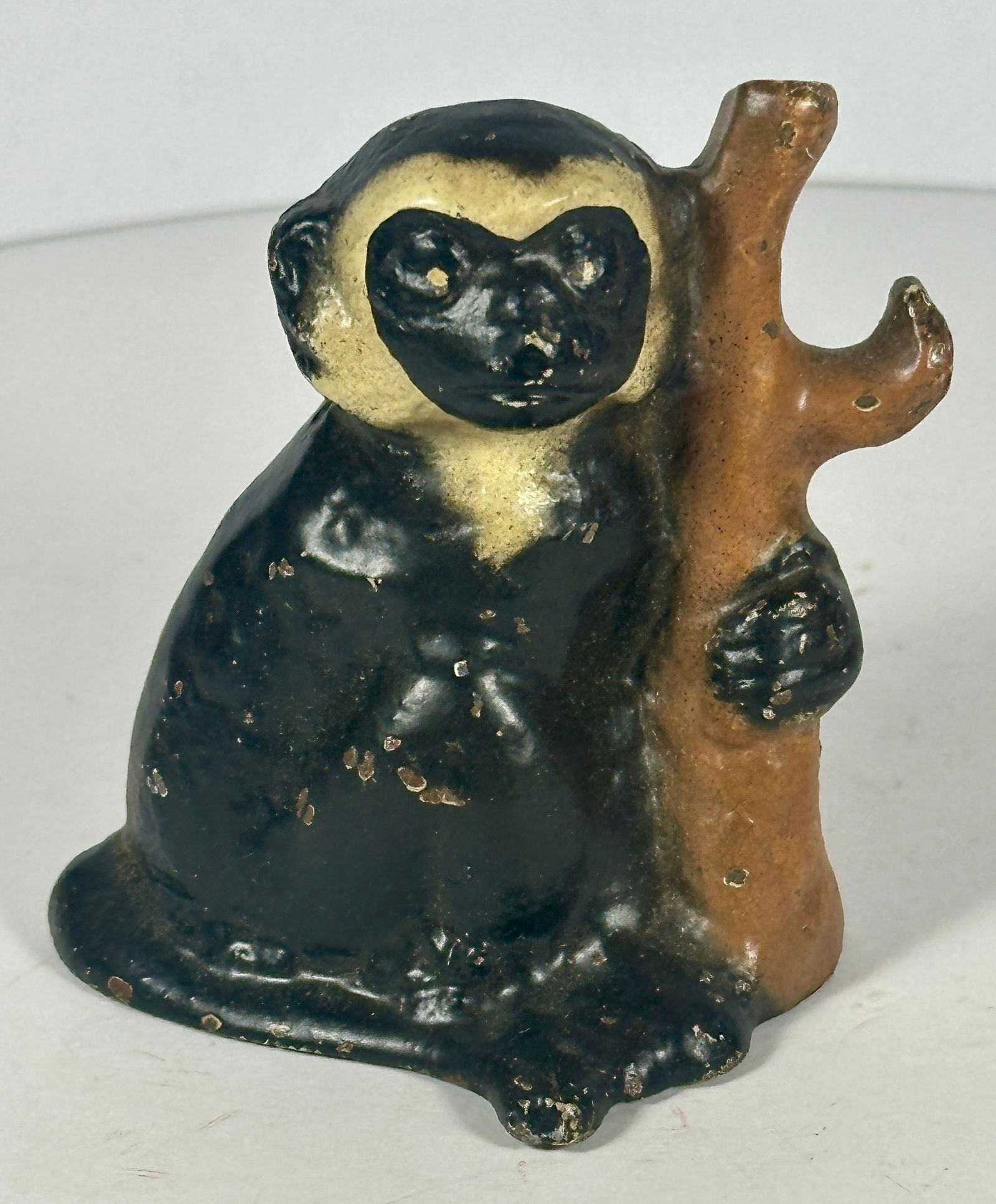 Monkey Cast Iron Bottle Opener: John Wright Co., PA. 2-5/8"T. c.1947. Catalog No. F89