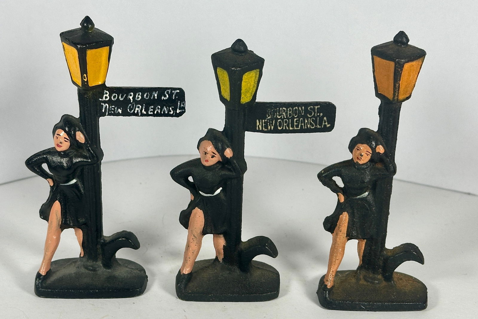 3 Mademoiselle Lamposts Cast Iron Openers: John Wright Co., PA. 3 pieces. 4-1/2"T. c.1960. Catalog No. F10