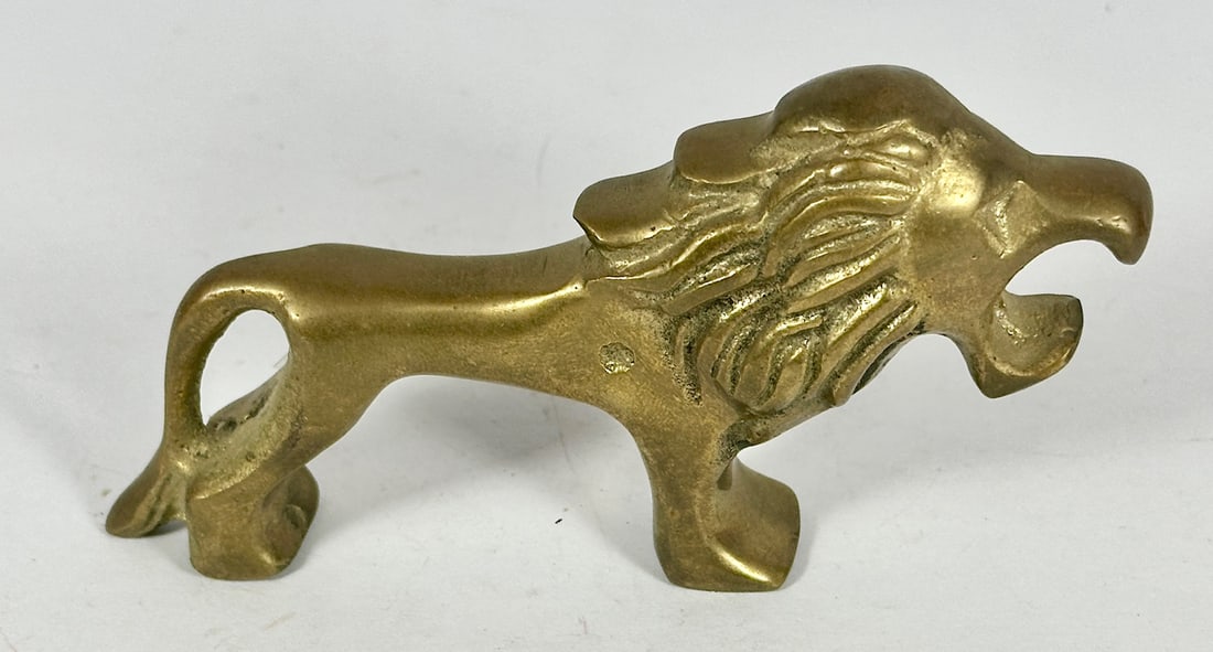 Lion Bottle Opener: Rare; Rated D. Brass. 4-1/2"L. c.1960. Catalog No. F88