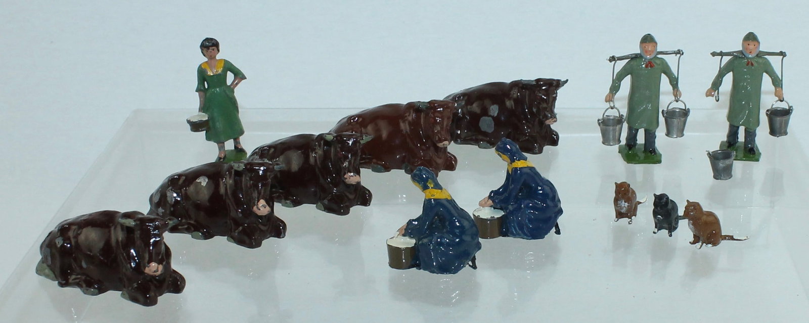 Britains Farm Dairy Lot: Farm Series. Lot includes 2 of 537 Girl Milking, 532 Milkmaid, 2 of 591 Dairyman, 5 of 534 Cow and 3 of 604 Cat. 13 Pieces. Condition Good to Excellent. No Box.