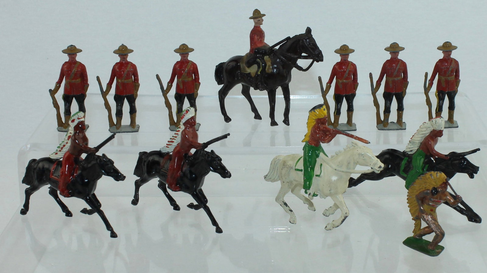 Johillco Lot Canadian Mounties and Indians: Lot includes 1 Mounted and 6 Foot Royal Canadian Mounties, 4 Mounted and 1 Foot North American Indian. 7 Pieces. Condition Good to Very Good. Rifle Broken on 1 Mountie. Horse Tail Missing on Mounted I