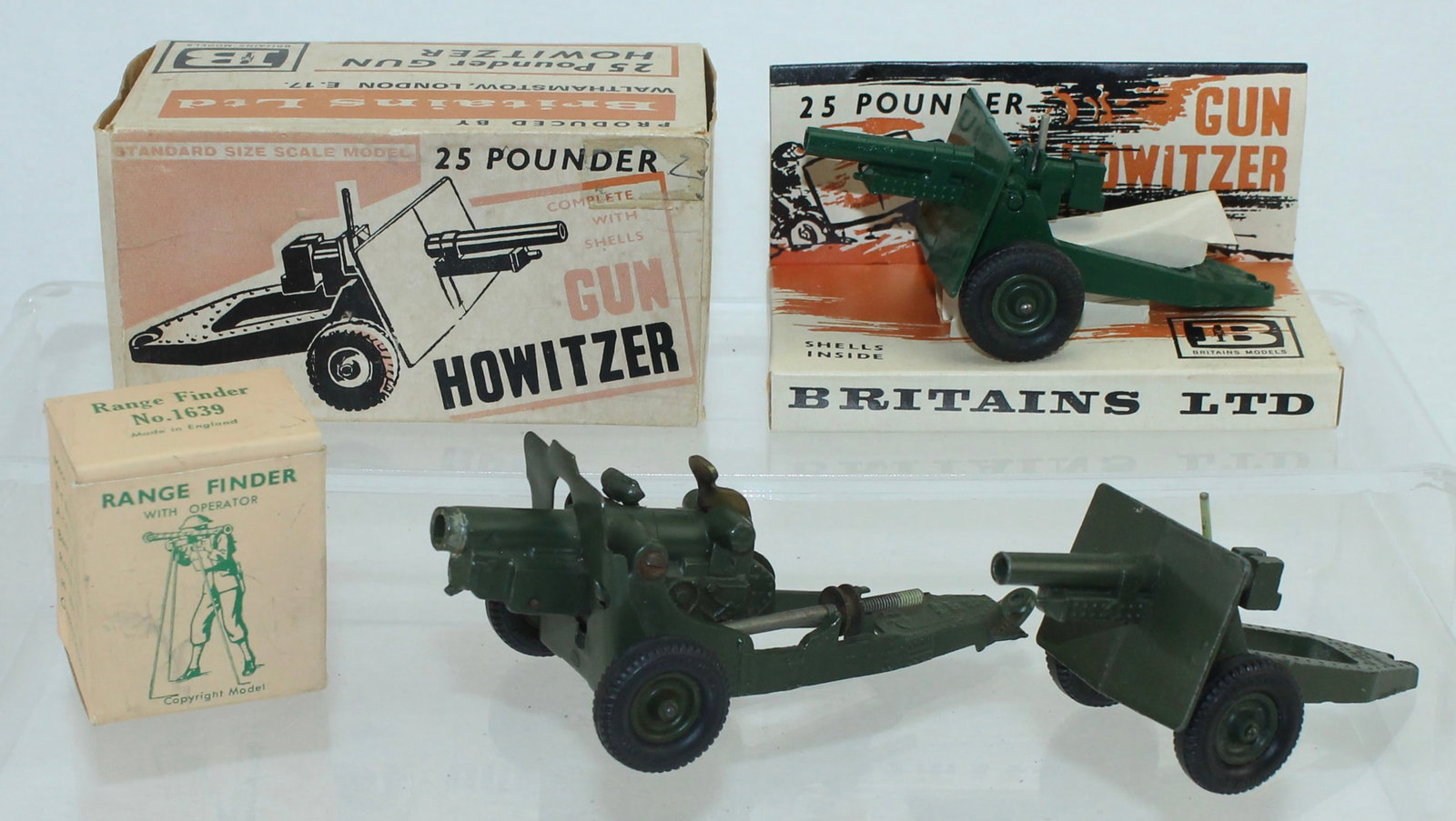 Britains Lot of Post-War Artillery: Includes 2 of Set 9705 25 Pound Gun Howitzer, 1 Boxed and 1 Unboxed, Set 1725 4-1/2 inch Howitzer, and Set 1639 Range Finder with Operator, Boxed. 5 Pieces. Condition Good to Mint. Boxes Good to Very 