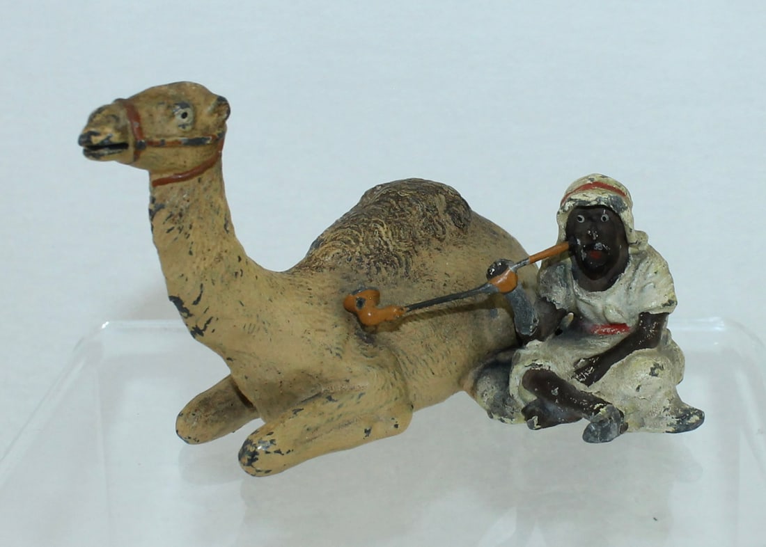 Heyde Bedouin with Camel: Bedouin Smoking Long Pipe Seated by Lying Camel. 1 Piece. Condition Good. No Box.
