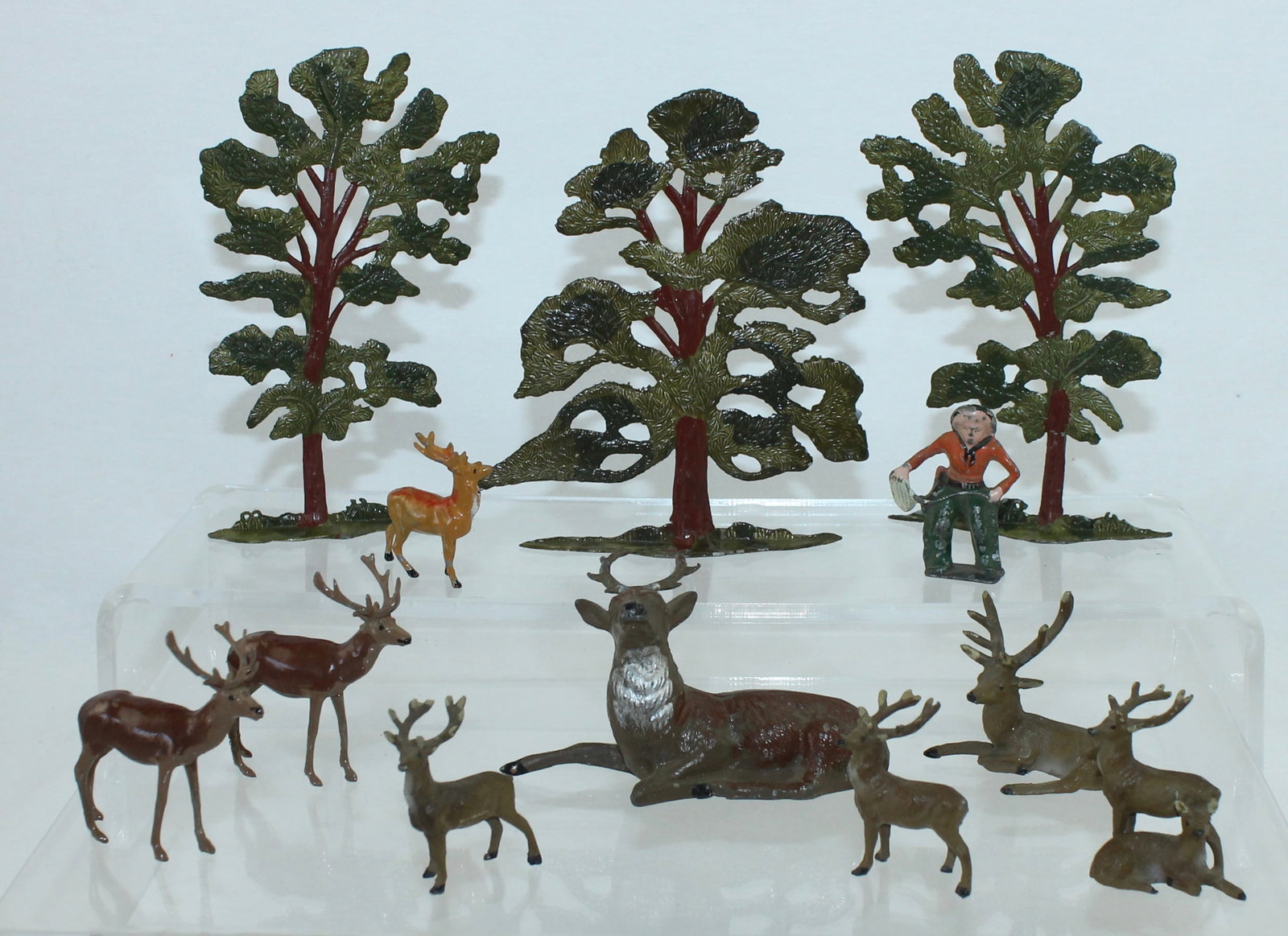 Japanese Lot of Deer: Lot includes 9 Deer, Cowboy and 3 Trees. 12 Pieces. Condition Very Good. No Box.