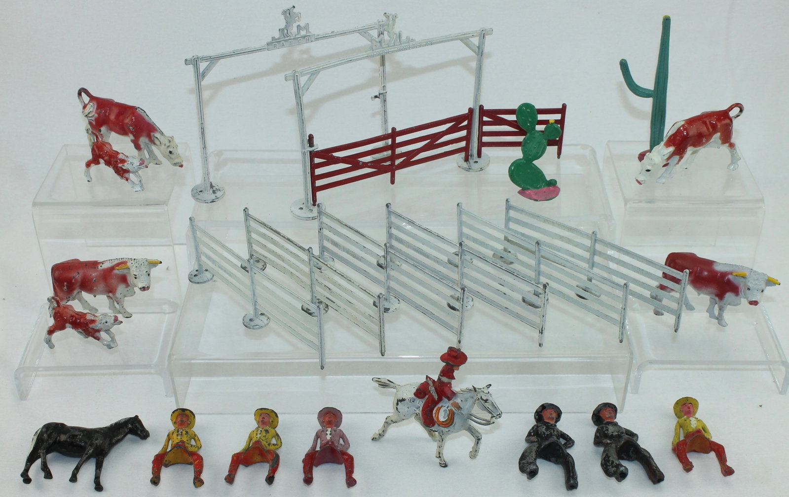 Manoil Lot Cowboys, Cowgirls, Fencing: My Corral Ranch Series. Lot includes 2 of M211 Ranch Gate with Fences. One Complete and One Lacks Gate. Also Includes 2 of M207 Seated Cowboy and 4 of M208 Seated Cowgirl, M209 Mounted Cowboy, Cacti a