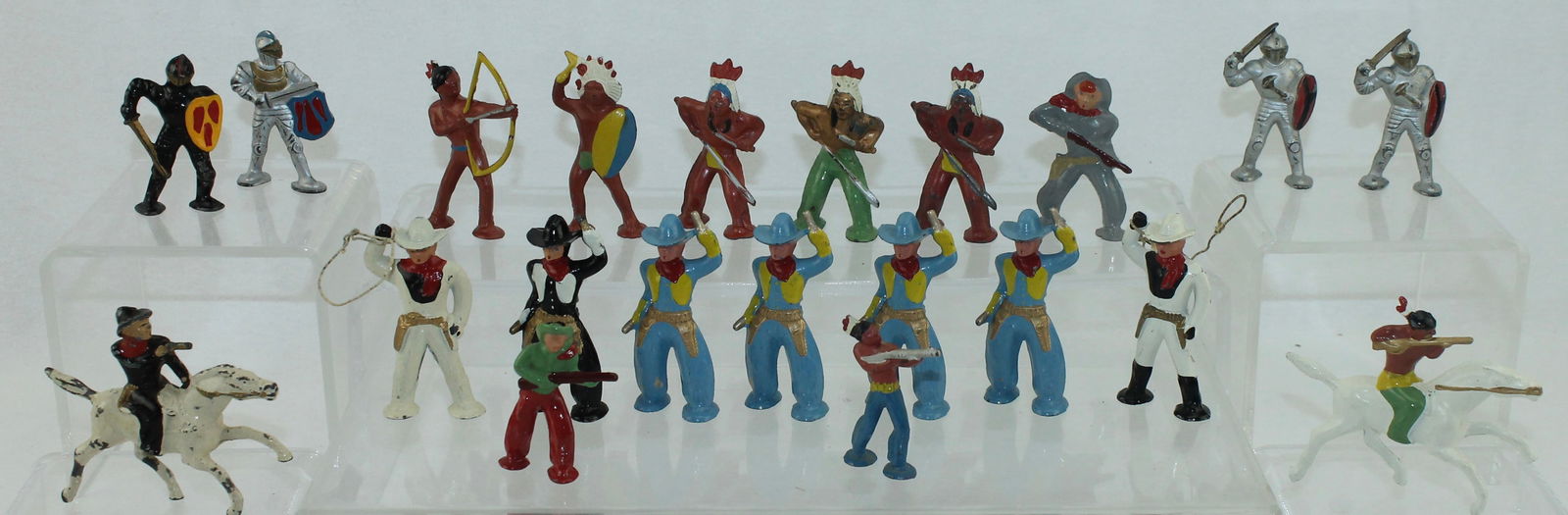 Lot of Barclay Pod Foot Cowboys, Indians: Lot includes B226 Mounted Indian, B254 Foot Indian with Bow and Arrow, 227 Mounted Cowboy with Pistol, B249 Cowboy with Lasso, B230 Knight and Others. 21 Pieces. Condition Very Good to Excellent. No B