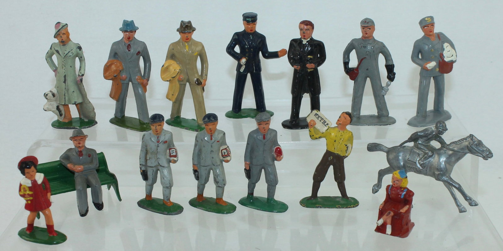Barclay Lot of Train Figures: Includes B161 Conductor, B162 Engineer, B164 Girl, B163 Boy , B169 Newsboy and Others. 16 Pieces. Condition Very Good to Excellent. No Box.