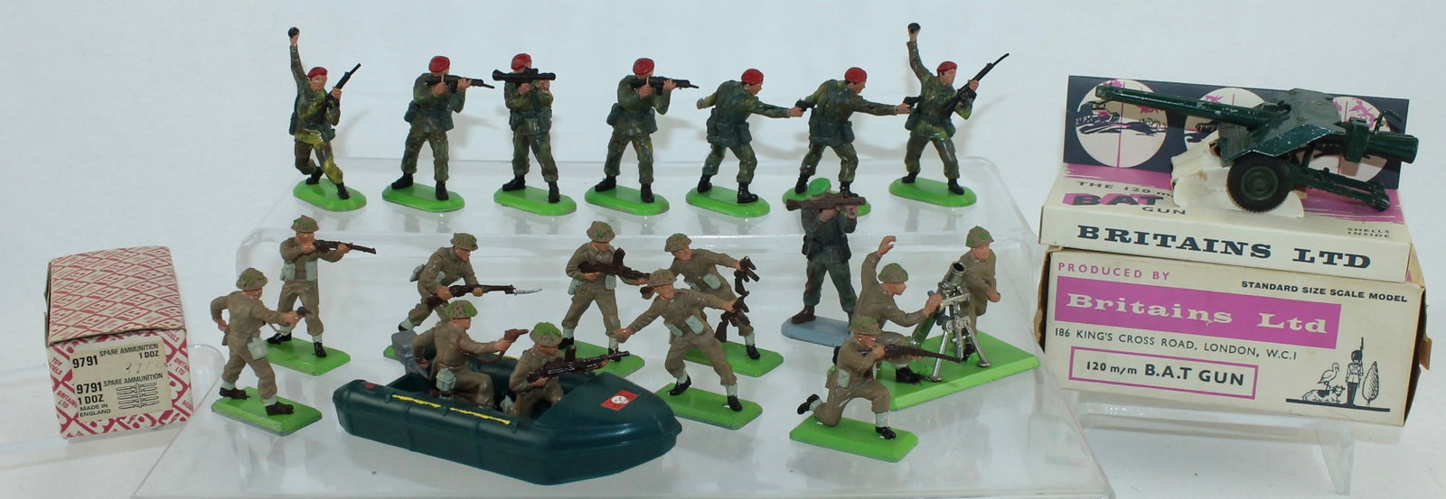 Britains Lot Commandos and Japanese Infantry: Deetail Series. Lot includes a Bazooka Duplex, Inflatable Boat, Commandos, Japanese Infantry and 9720 B.A.T. Gun in Original Box, 9791 Box of Spare Ammo. 19 Pieces. Condition Very Good to Mint. Gun Bo