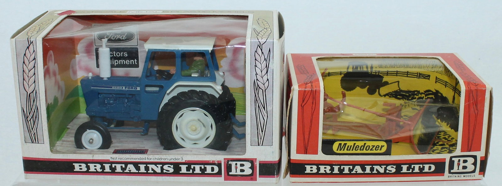 Britains Lot Tractor and Muledozer: Farm Series. Lot includes 9524 Tractor and 9535 Muledozer. 2 Pieces. Condition Mint in Box. Boxes Good to Very Good. Cello Loose and One Sticky Label on Tractor Box.