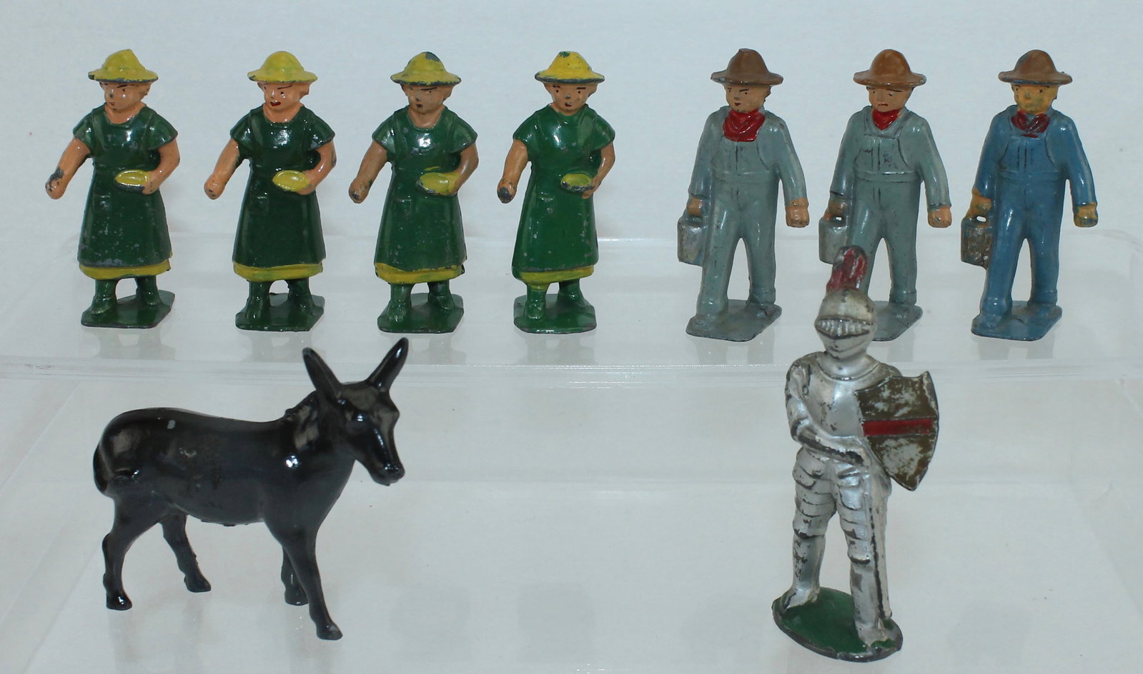 American Metal Toys Lot of Farmers and Wives: Lot includes 4 of AM38 Farmer's Wife, 3 of AM39 Farmer with Pails, AM40 Knight in Armour and Donkey. 9 Pieces. Condition Good to Very Good. No Box.