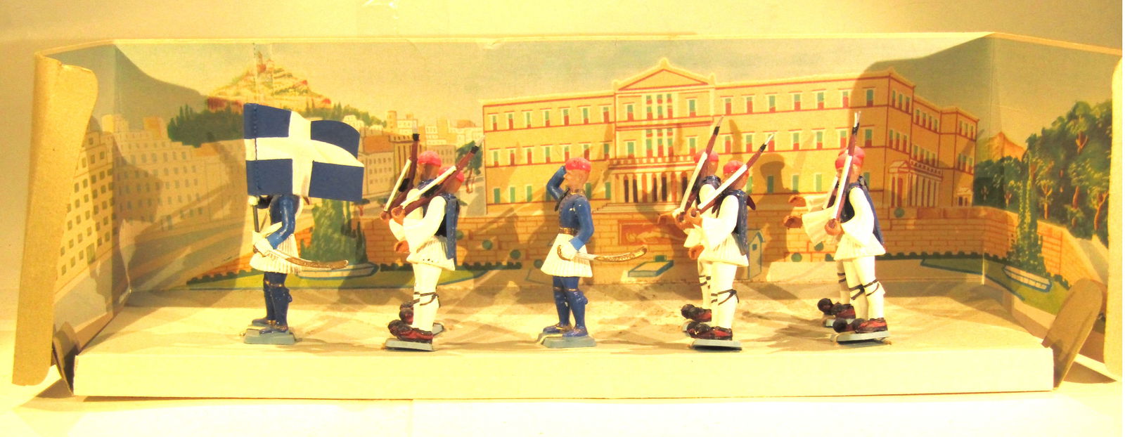 Ahona Greek Evzones: Ahona (Greece) Box of Greek Evzones (light infantry, traditional dress) in blue. 8 pieces (plastic) in original box. Condition Excellent. Box Excellent.