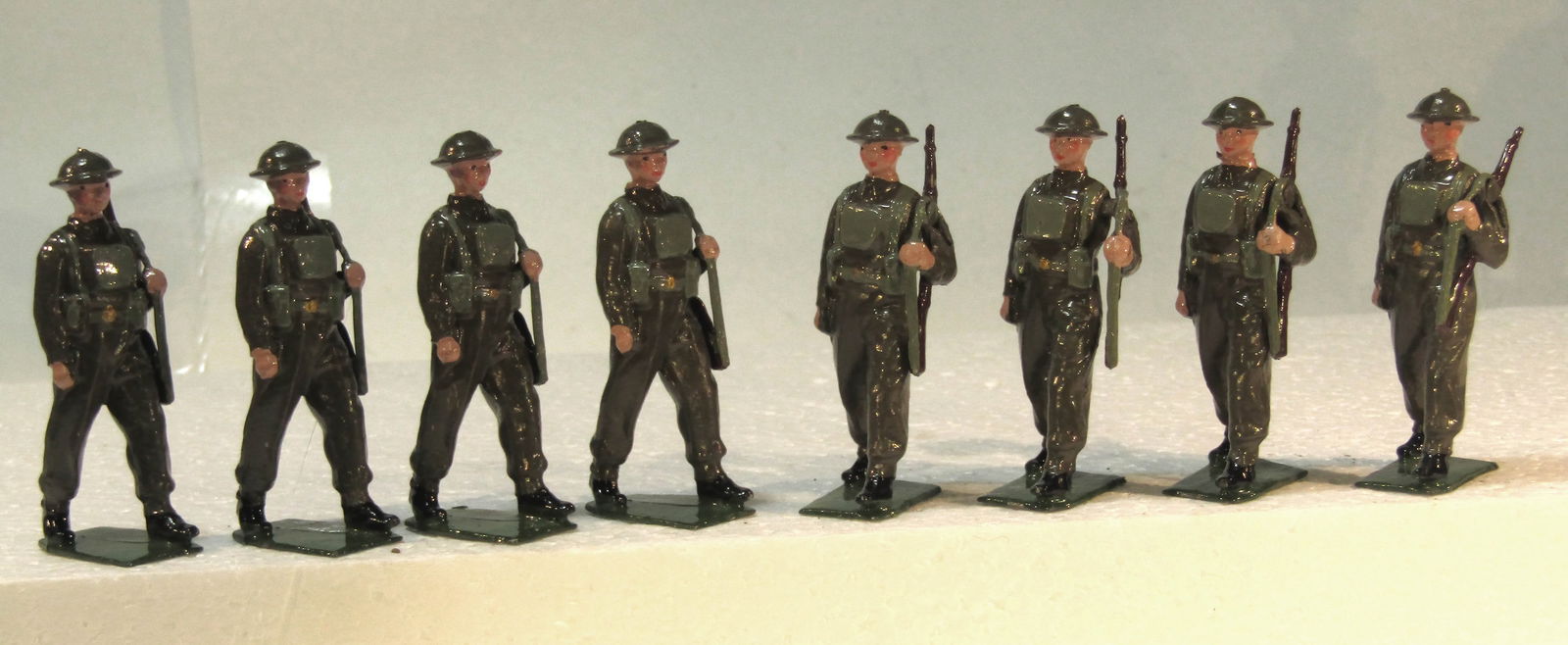 Britains No 1858 British Infantry in Battle: Britains Ltd. # 1858. British Infantry in Full Battle Dress and shrapnel-proof helmets and slung rifles. Late pre war paint (1940-1941 only). 8 pieces. Condition Excellent. Unboxed.