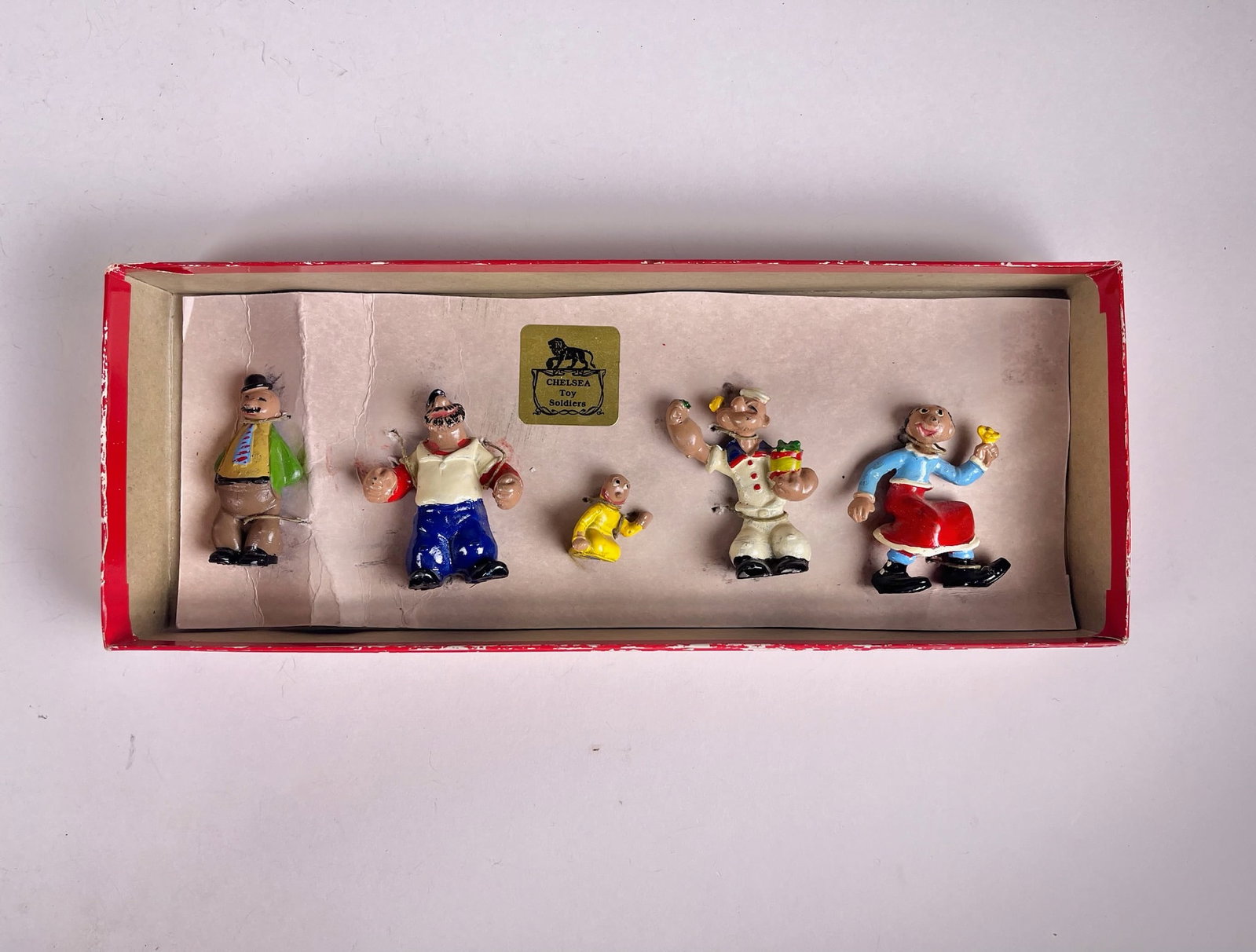 Chelsea Popeye with his Gang: Terrific boxed set with Popeye holding his beloved spinach, Olive Oil, Wimpy, Bluto, and Sweet Pea. 5 pieces. Condition excellent. Box very good with tie card.