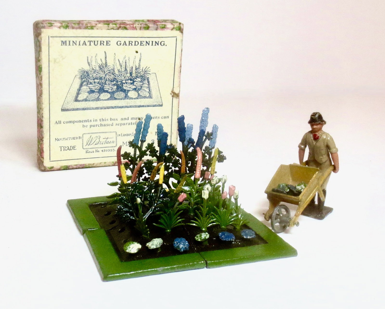 Britains RARE #MG3 Miniature Garden: Pre war, circa 1930. Near mint to excellent condition (missing some flowers). Comes with a bonus Crescent Gardener with wheel barrow. Original illustrated box excellent.