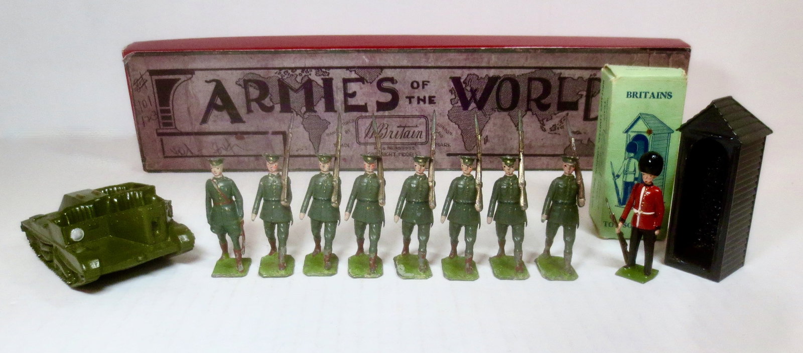 Britains Assortment: #1603 Pre war Republic of Ireland Infantry in fair condition with reproduction box, an unboxed Bren Gun Carrier in very good condition but missing crew, and #329 Sentry box near mint in an excellent b
