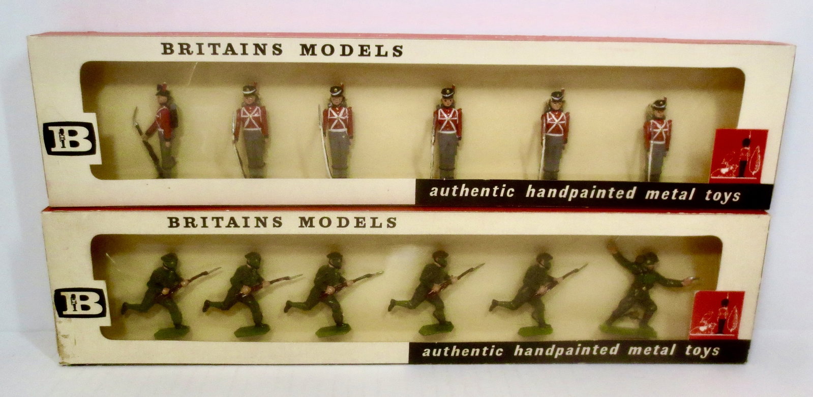 Britains #9160 Fort Henry Guards: And, #9146 British Infantry Charging. 12 pieces. Mint condition, tied to card in window boxes. Boxes good (cellophane coming loose).