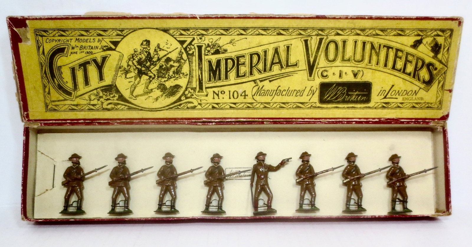Britains RARE #104 City Imperial Volunteers: Rare Boer War uniformed City Imperial Volunteers standing at ready, with pistol firing officer. 8 pieces. Pre war. undated oval bases. Pristine condition. Box in good condition.