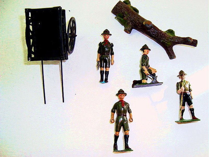 Britains From Set # 161 Boy Scouts: Scout with Trek Cart, Scout Kneeling with Axe, Scout to stand on Tree with Axe and walking Scout with Pole and fallen tree. Pre War 6 Pieces. Post War. Unboxed.