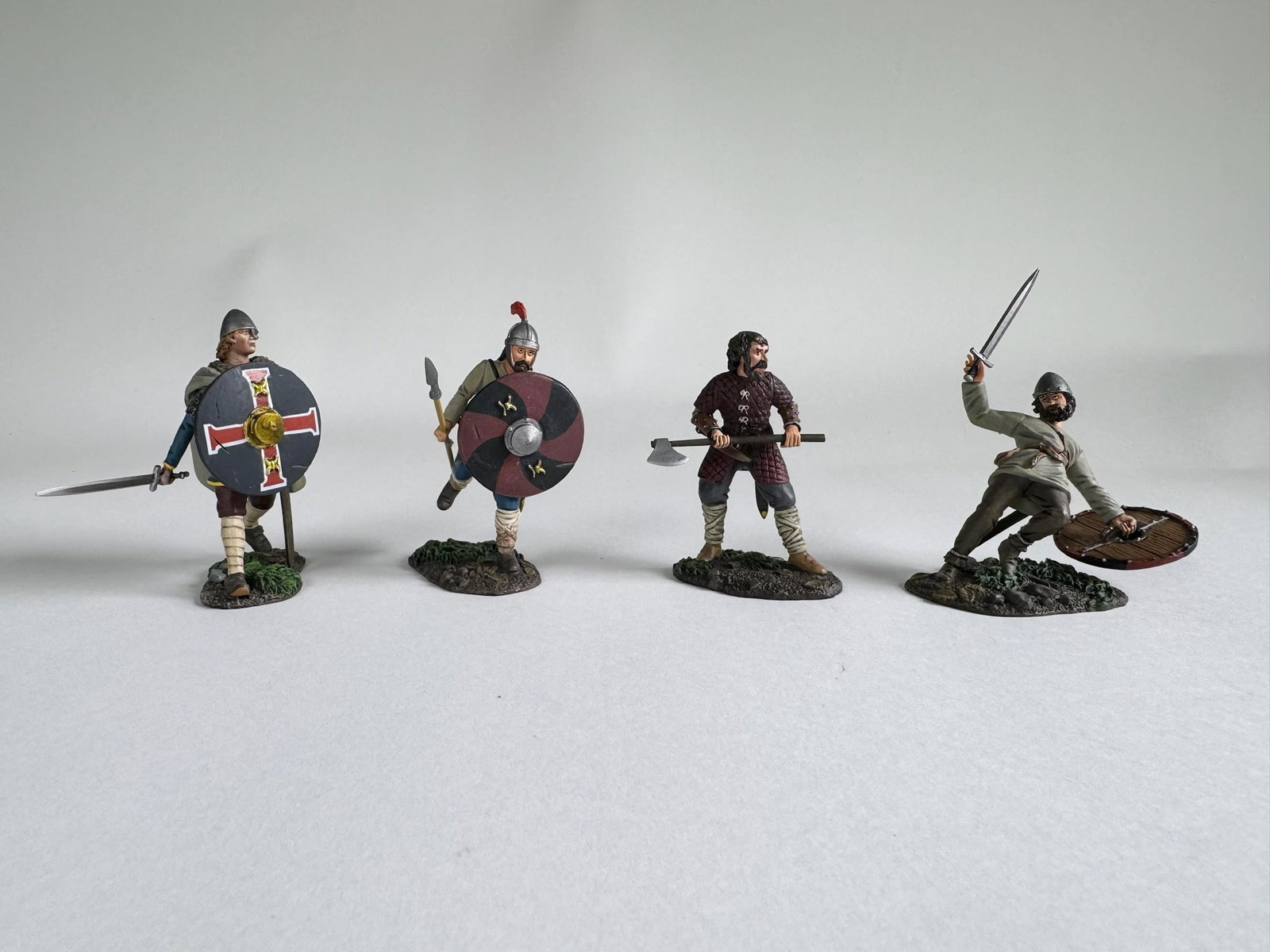 Britains Wrath of the North Men Assortment: 4 sets. No 62130 - Kenway: Saxon Advancing with Sword. No 62116 - Saxon Warrior Running with Spear No. 1 (Osgar). No 62117 - Saxon/Viking Warrior with Ax (Carl). No 62118 - Saxon Casualty Falling No. 