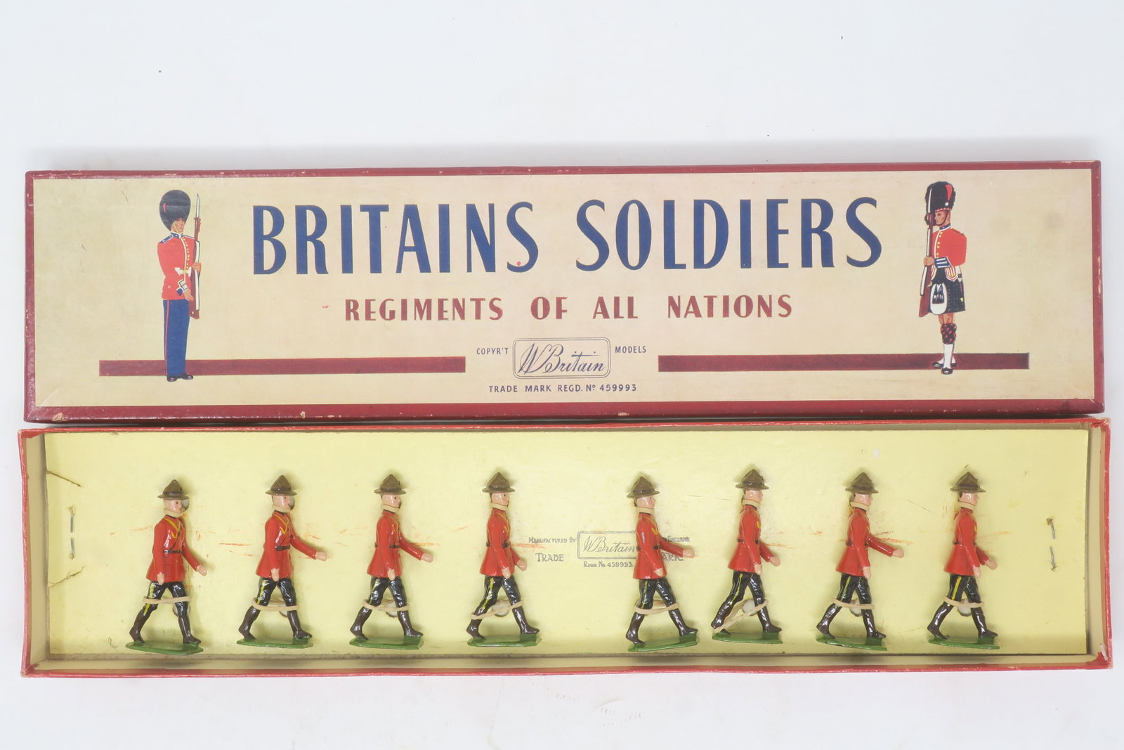 Britains set #1554 Royal Canadian: Mounted Police dismounted (marching), 8 pieces, in an original Regiments of All Nations box; Excellent; Mint