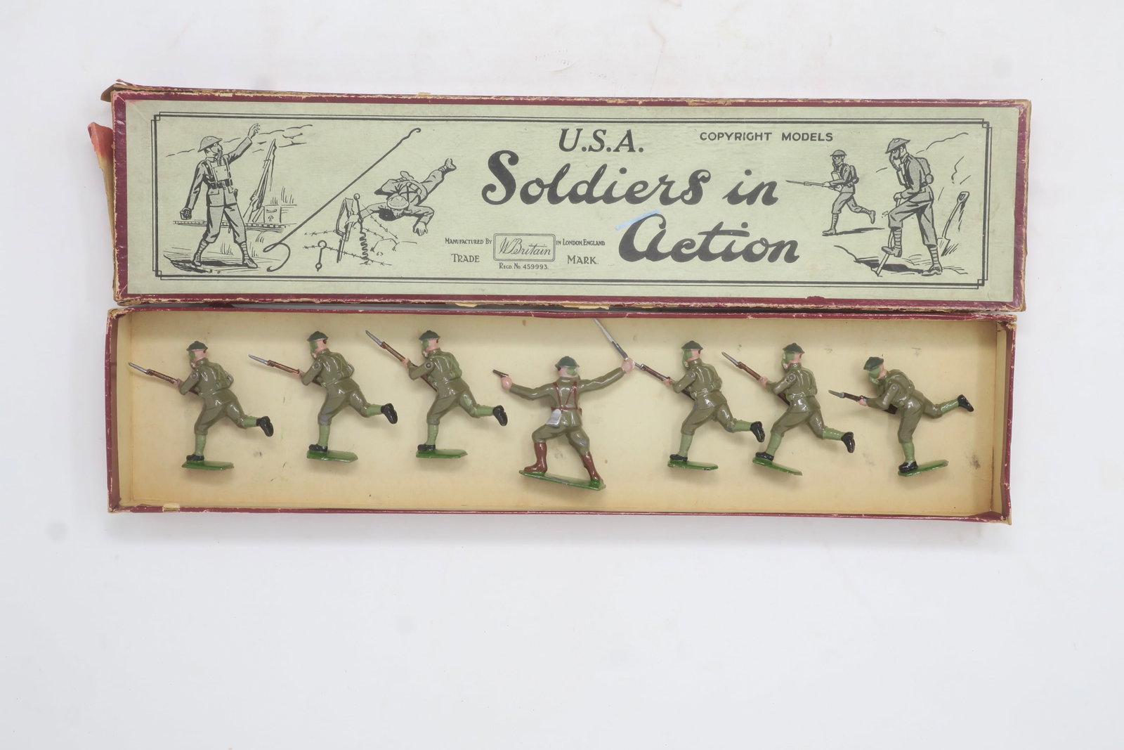 Britains set #1625 U.S. Infantry: in gas masks charging with officer, in original box, 7 pieces; Excellent; box fair-good some splits, no tie card or end label