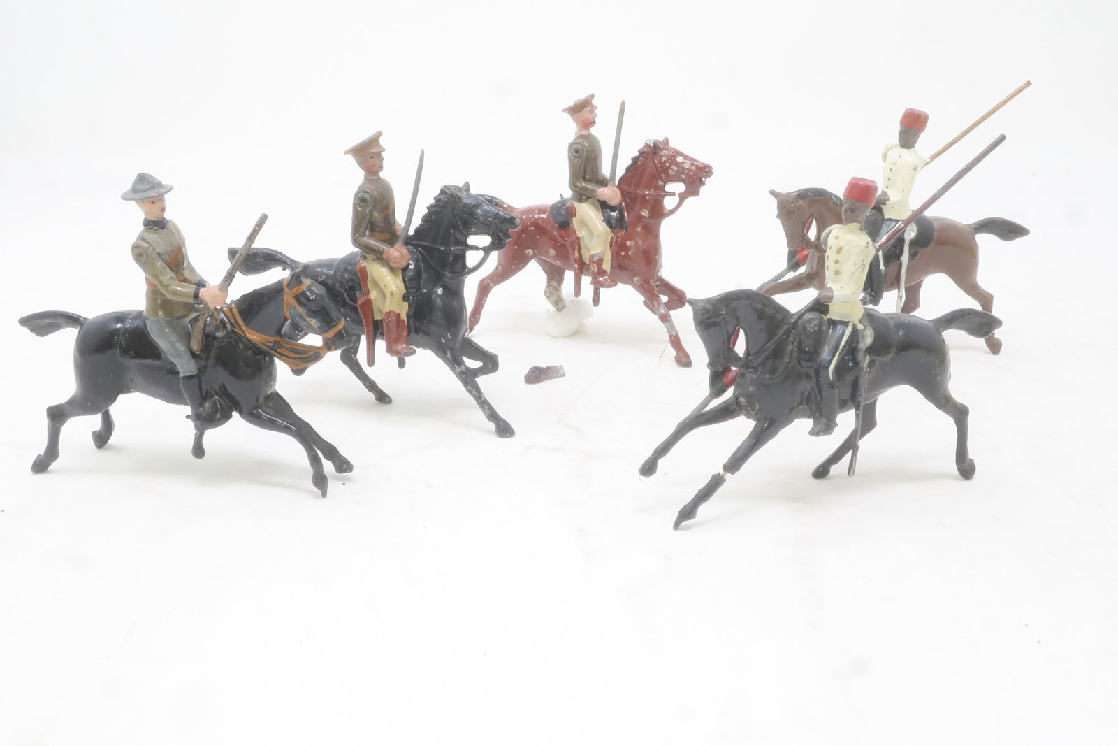 Britains from set #115 Egyptian Cavalry: plus two British Yeomanry and a South African Mounted Infantryman, 5 pieces, circa 1935; Good, one head loose and two legs detached but present