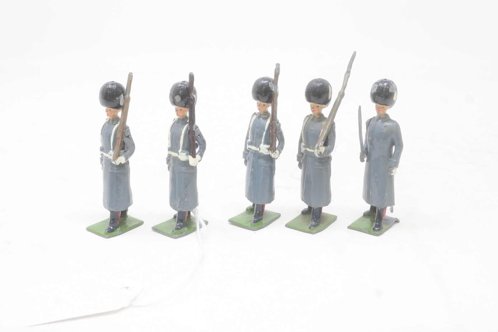 Britains from set #312 Grenadier Guards: in Winter dress with officer, 5 pieces; Good, but most rifles damaged