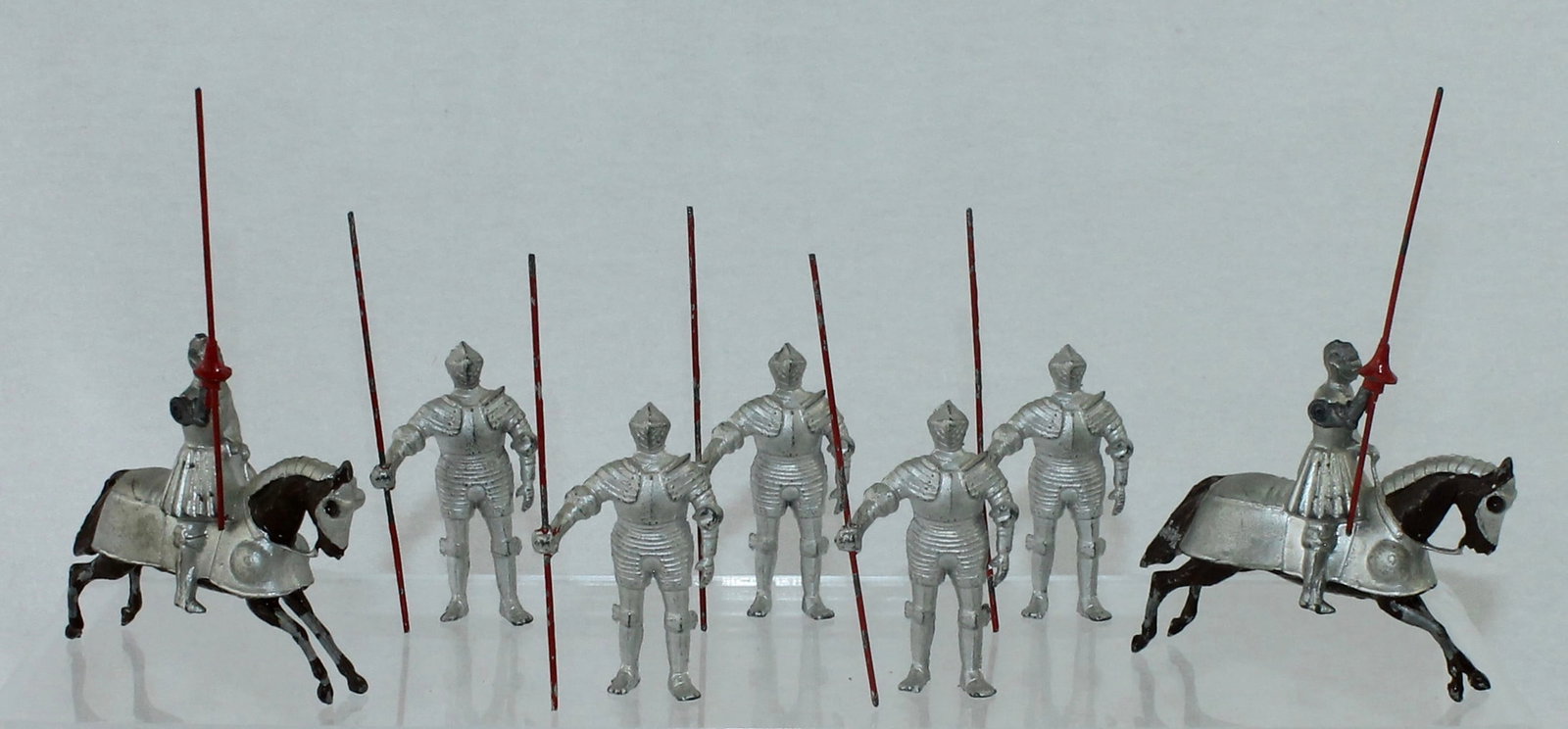 Britains From Set 1307 16th Century Knights: 16th Century Knights Mounted and Foot. Includes 2 Mounted Knights with Lances and 5 Dismounted Knights. 7 Pieces. Condition Good to Very Good. Paint Loss to 2 Horse's Legs. No Box.