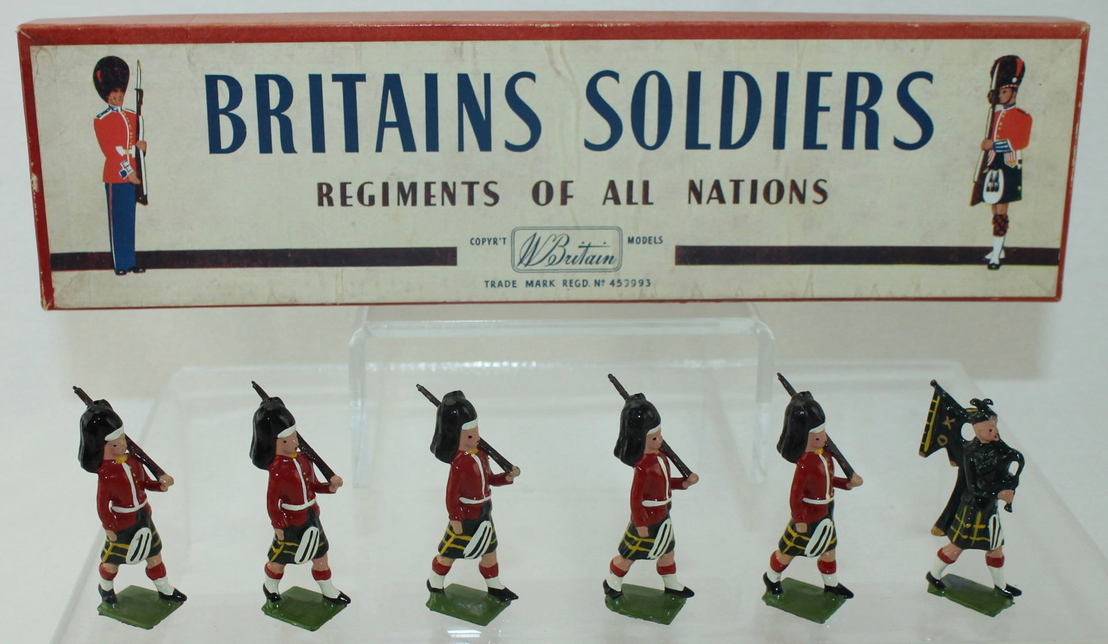 Britains Set 77 Gordon Highlanders with Piper: 6 Pieces.Condition Excellent. Untied in Box. Box Good to Very Good with Fading.