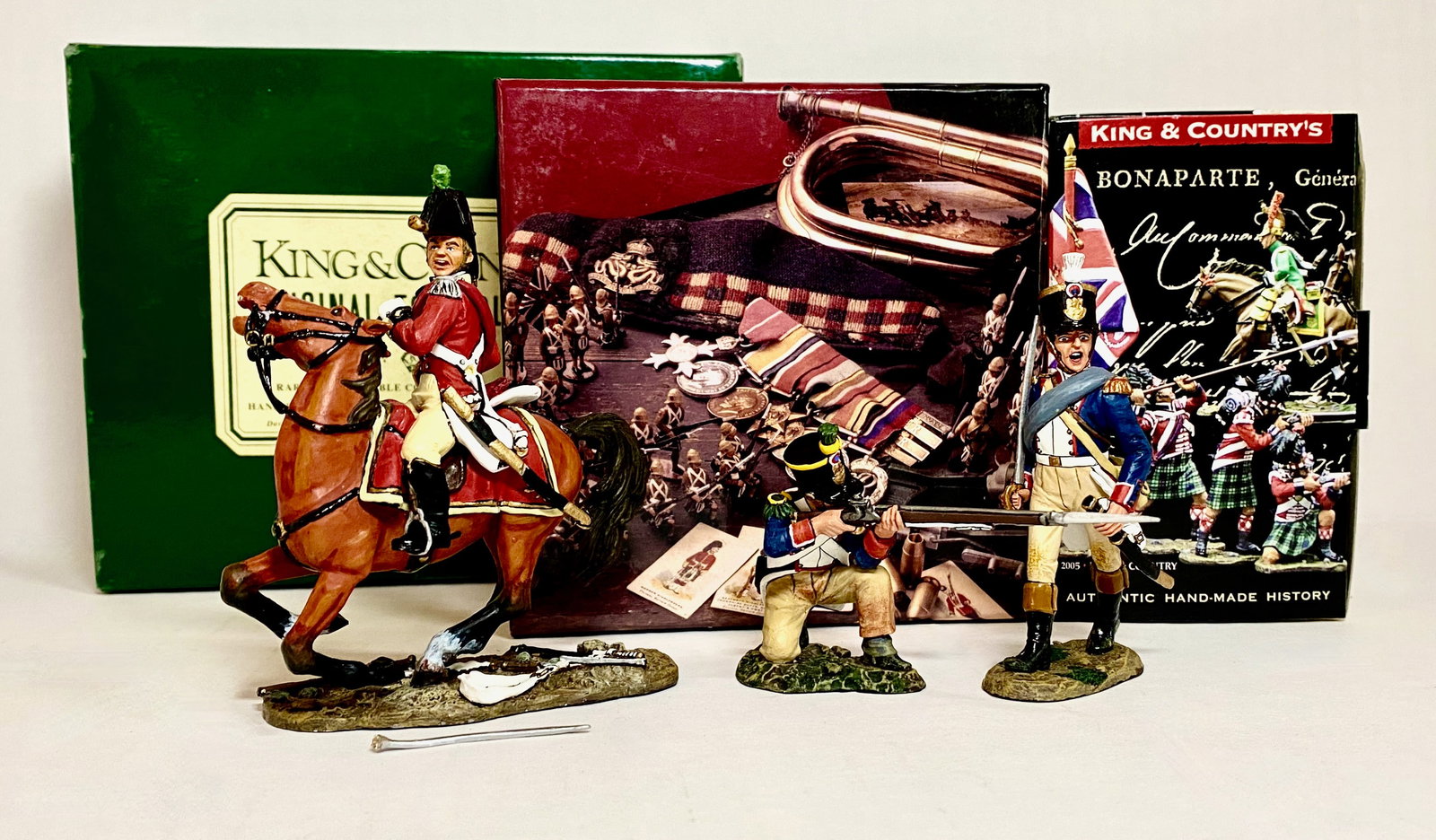 King & Country Napoleonics Figures: 3 pieces. #NA10, #NA229, #NA278. Mounted officer's sword broken loose, the rest in mint condition. Boxes excellent.