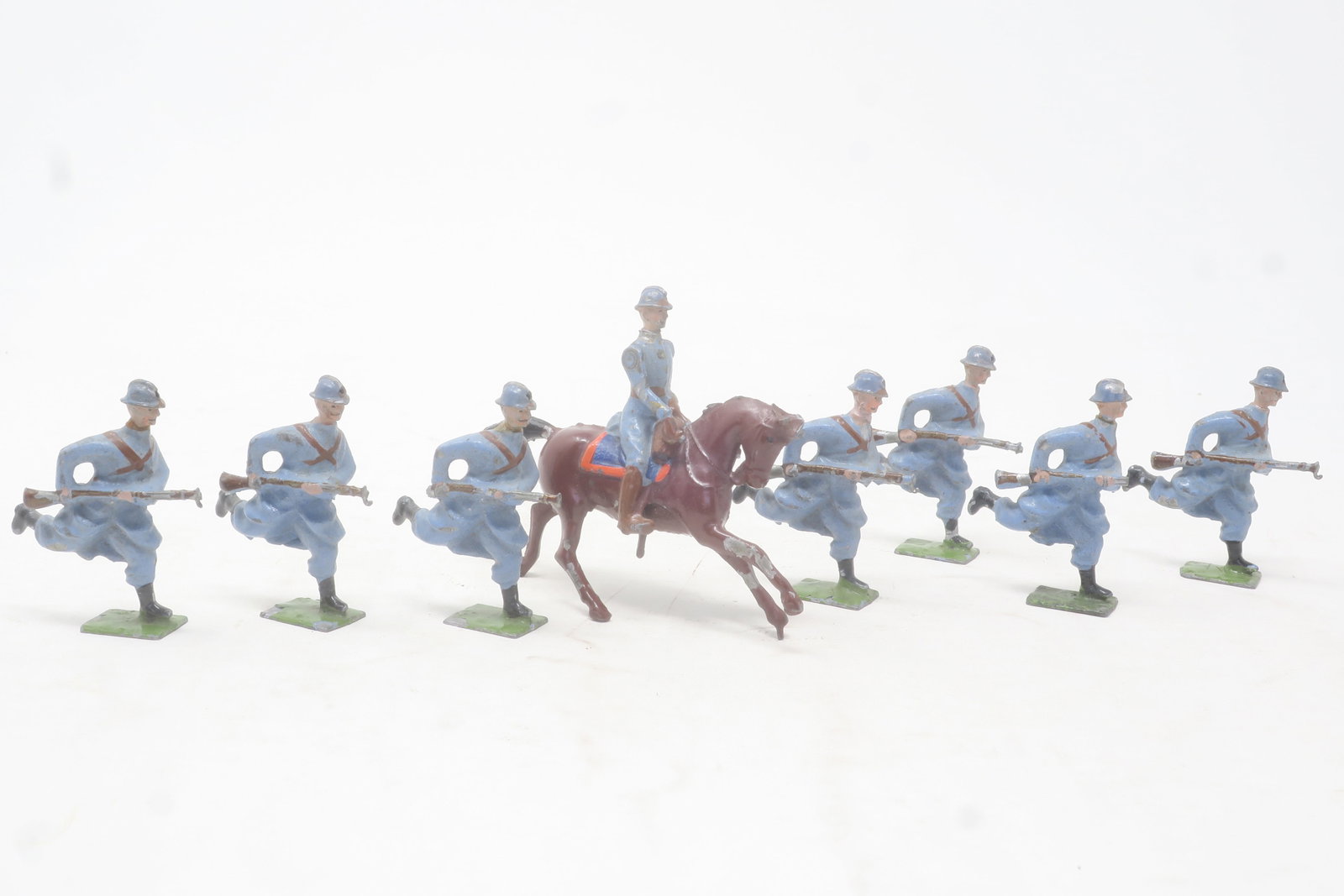 Britains Paris Office Poilus,: service dress charging with mounted officer, c. 1916, 8 pieces; Very good, but all bayonets damaged, one head loose, officer's sword gone