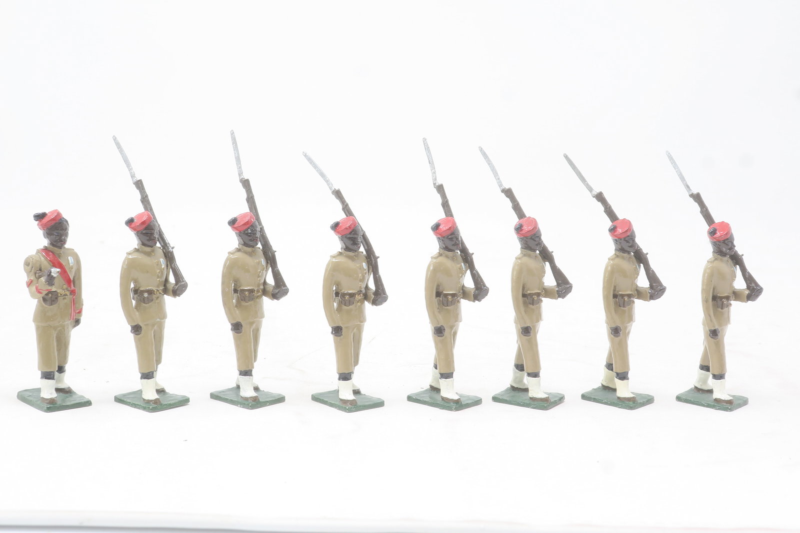 Nostalgia Royal Niger Haussas: Military Police (1899), black faces, red pill box caps, khaki uniforms at slope, 8 figures including officer; Excellent