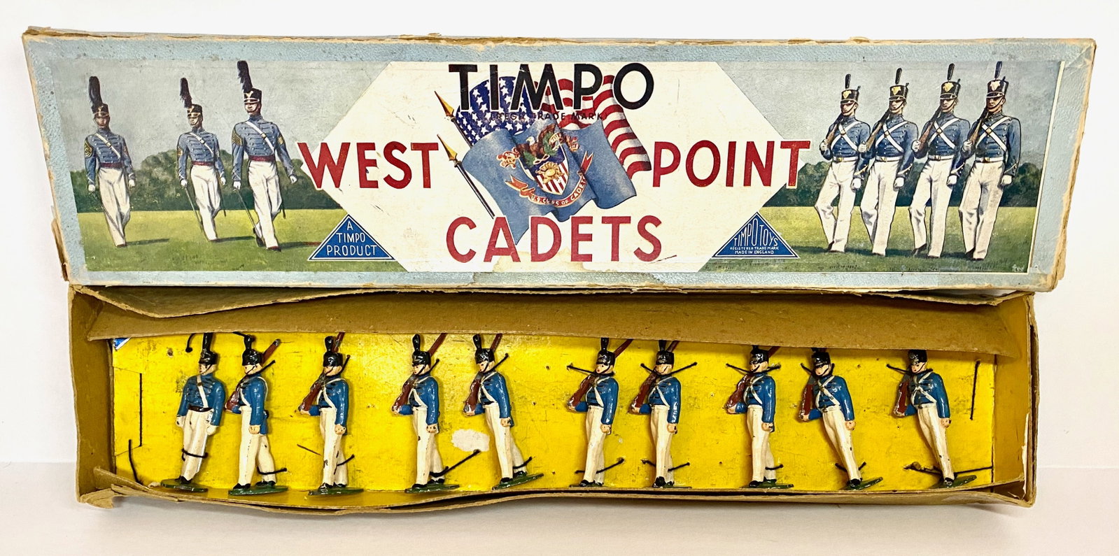 Timpo West Point Cadets: 10 pieces. Excellent condition. Box fair (top stains and taped repairs).