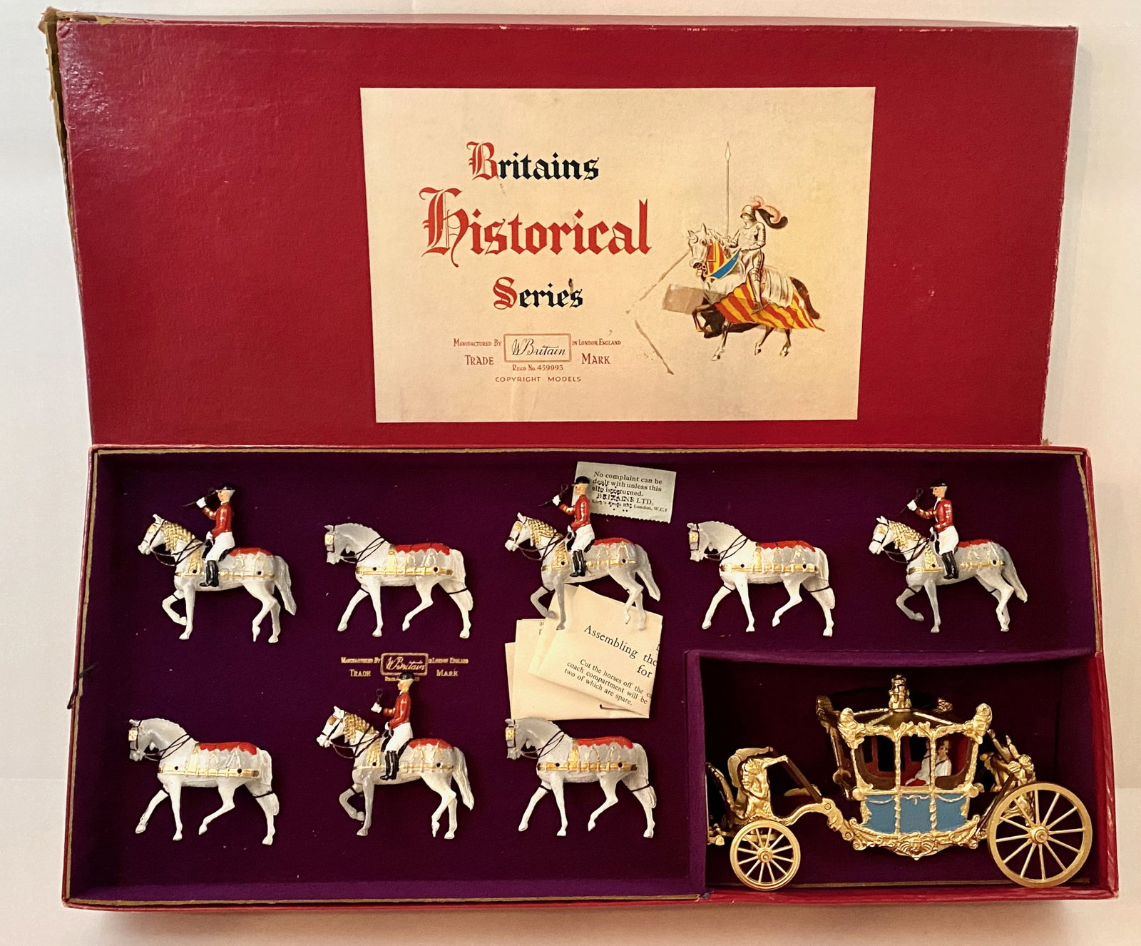 Britains #9401 Her Majesty's State Coach: Post war issue. 10 pieces, plus traces. Mint to near mint condition. Box fair (top splits).