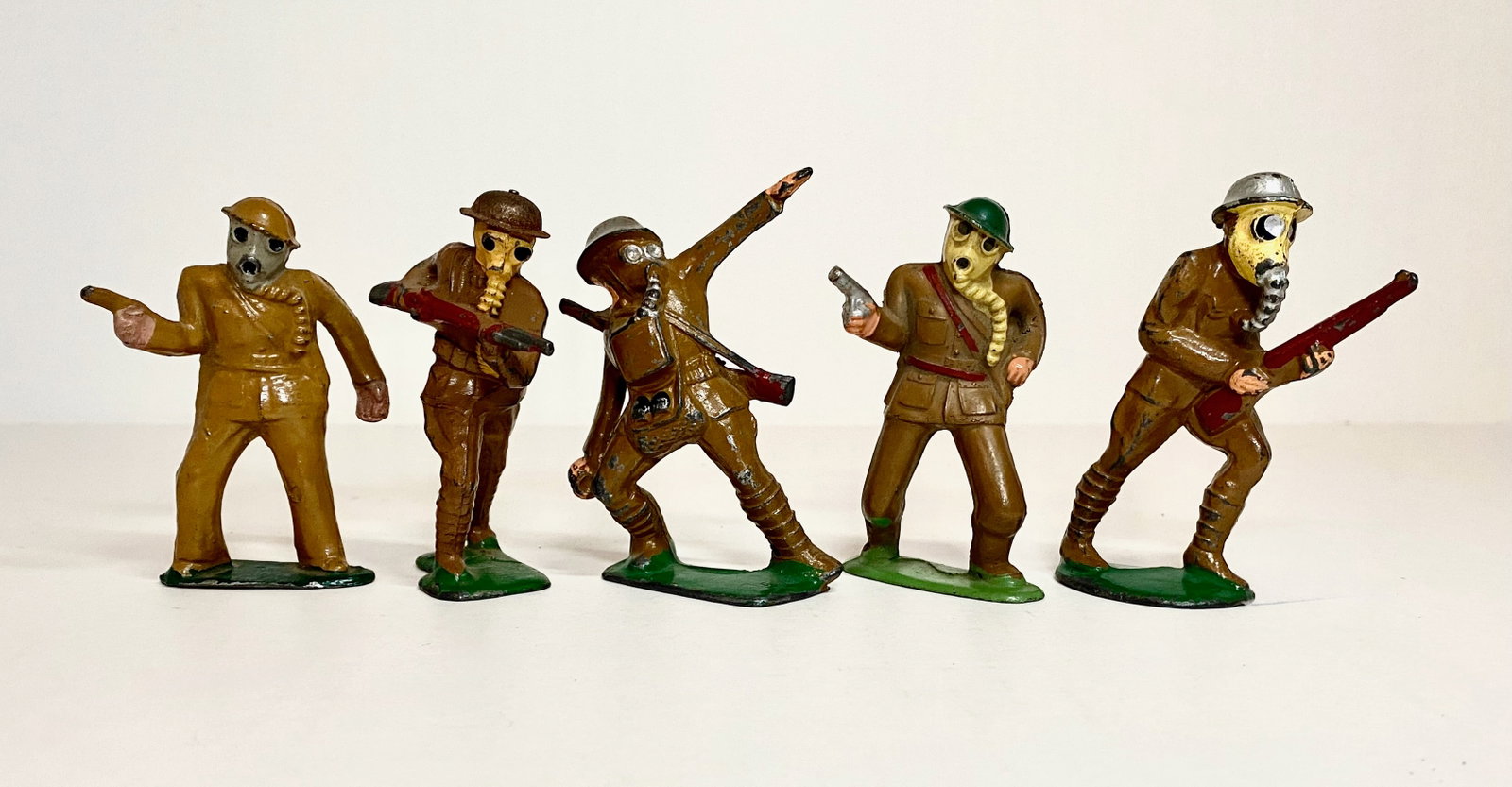 Dimestore Assorted Soldiers in Gas Masks: Variety of makers. 5 pieces. Excellent to good condition. No boxes.
