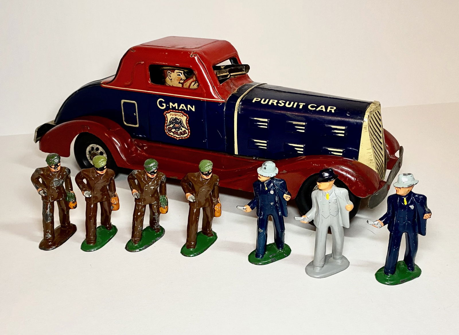 MARX Pressed Steel Wind up G-Man Pursuit Car: Plus Barclay Dimestore Robbers & Detectives. Car in excellent untested condition (missing wind up key), with some paint loss. Figures in excellent to good condition. Unboxed.