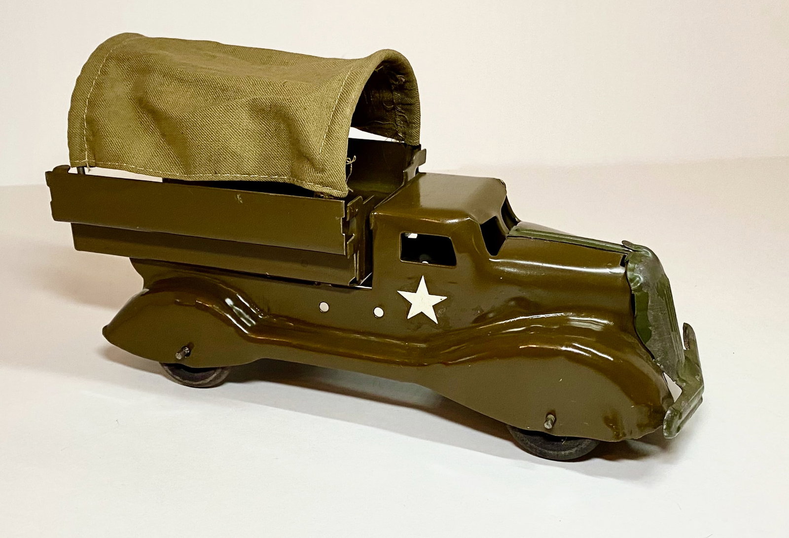 Marx Pressed Steel Army Transport Truck: 10.25" long. Excellent condition (minor paint loss). Unboxed.