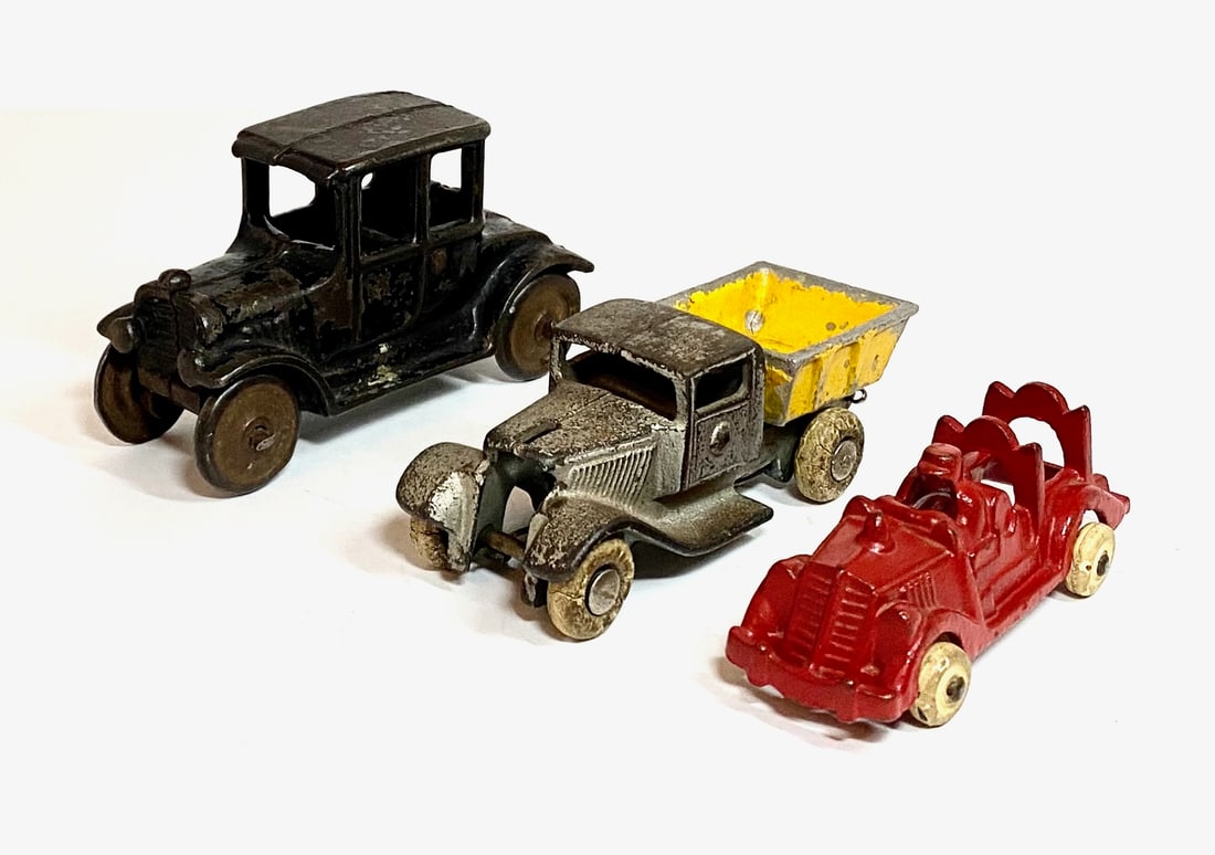 Arcade or Similar Cast Iron Vehicles: 3 pieces. Excellent to fair condition (truck missing front grill). Unboxed.