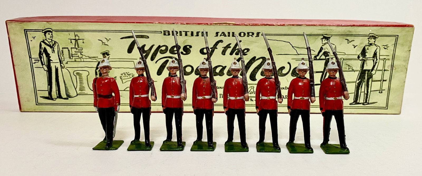 Britains #1620 Royal Marine Light Infantry: Scarce pre war issue, circa 1938. 8 pieces. Excellent condition, with original illustrated "Types of the Royal Navy" illustrated label box. Box excellent.