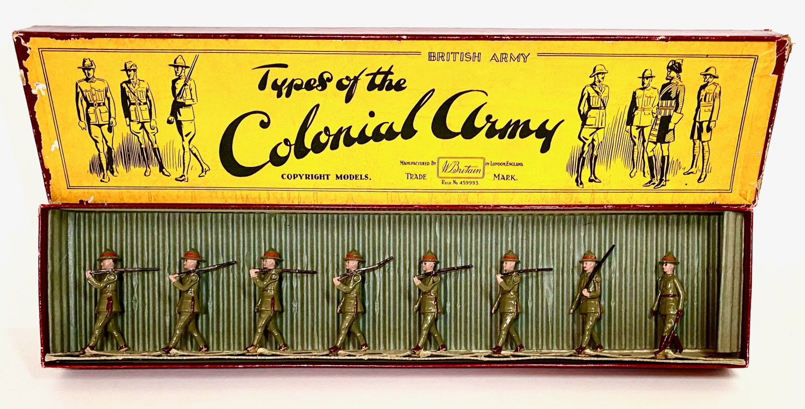 Britains #1542 New Zealand Infantry: In service dress, marching slope arms. 1938 version, with original illustrated "Types of The Colonial Army" box. 8 pieces. Near mint to excellent condition. Box excellent.