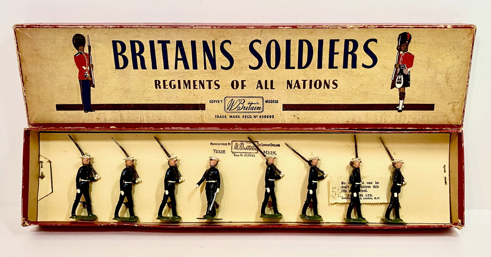 Britains #1835 Argentine Naval Cadets: Marching at the slope. Post war, restrung in ROAN box. 8 pieces. Near mint condition. Box very good.