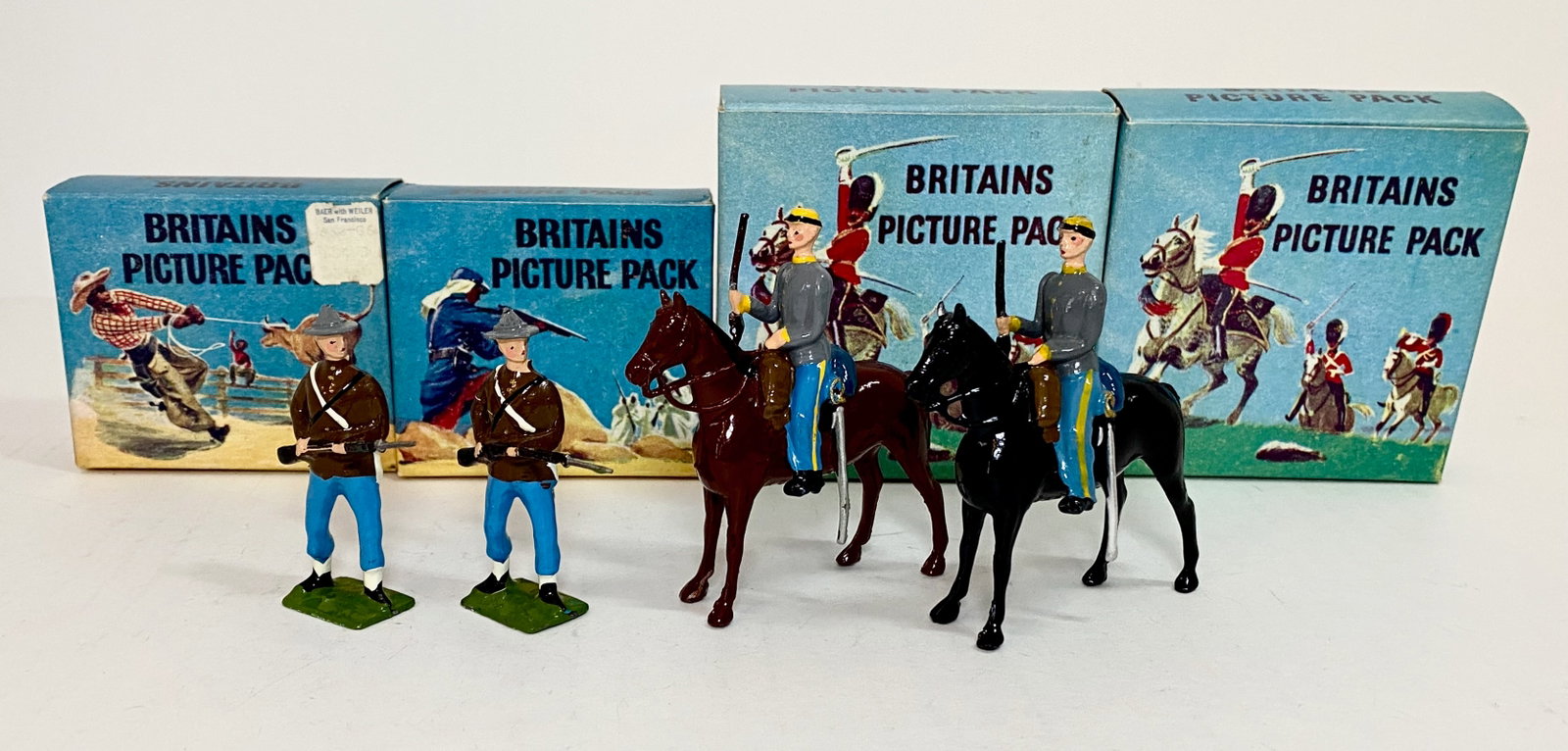 Britains Picture Packs: American Civil War #1240B Confederate Infantry, and #1365B Confederate Cavalry. 4 pieces. Mint to near mint condition. Boxes excellent.